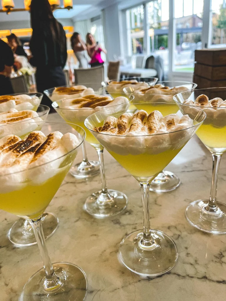 Individual lemon meringue cocktails ready for a taste test dinner party game